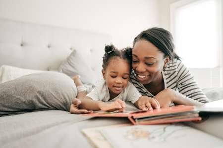 Mother and child reading together