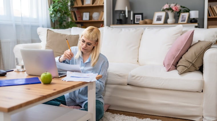 Young woman paying her bills.