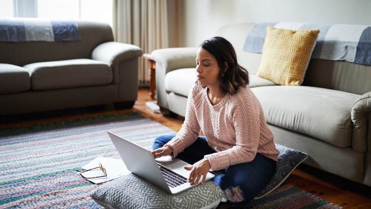 Woman working on her laptop.