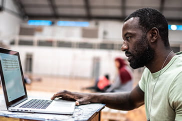 Man logging into the Project Porchlight education portal.