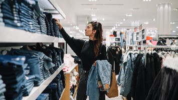 Woman shopping for jeans.