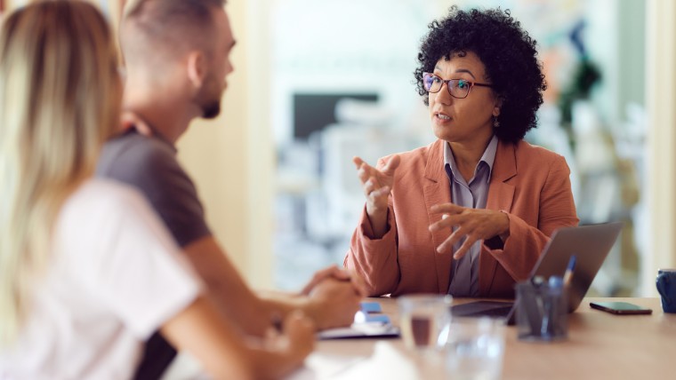 Financial advisor talking to couple.